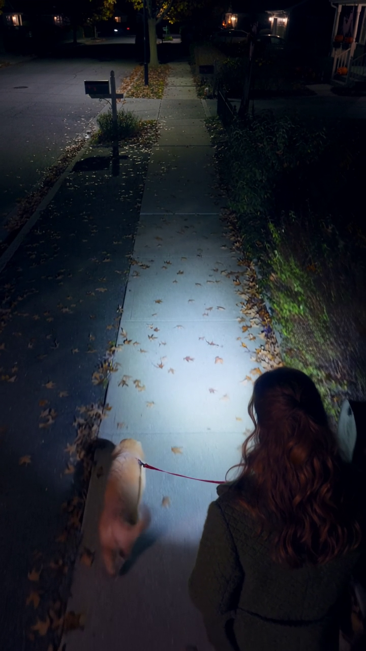 Yippy Light illuminating the sidewalk on a night walk